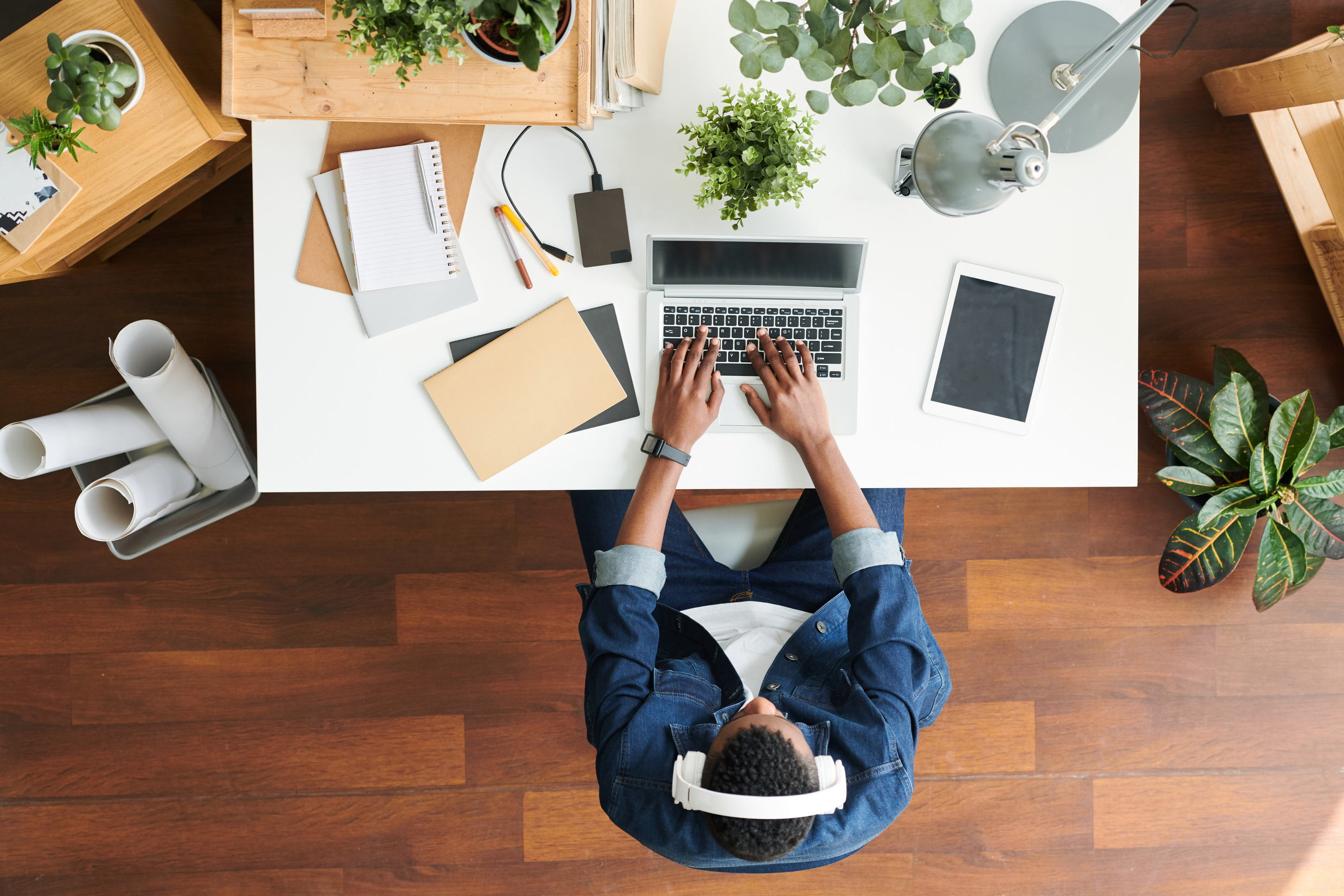 Guy typing by desk